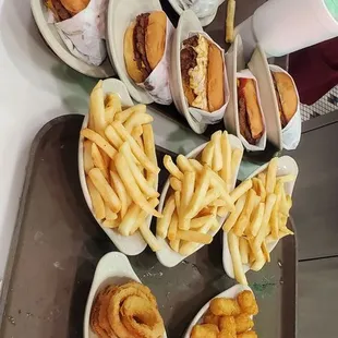 Burgers fries, tots and onion rings