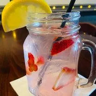 a strawberry lemonade in a mason jar