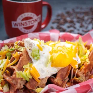 a waffle topped with an egg