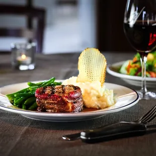 Bacon-wrapped filet served with mashed potatoes and green beans