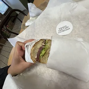 Pastrami sandwich on sourdough roll  with everything except onion. Toasted.