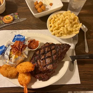 Ribeye with shrimp, Mac n cheese and loaded baked potato