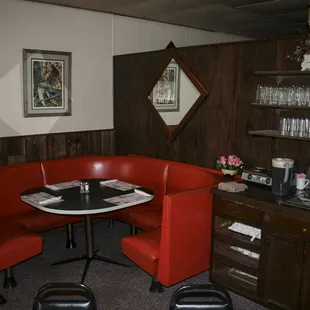 corner booth with red chairs