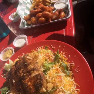 Surfer salad with blackened fish  Boneless Buffalo and fries