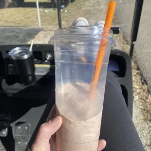 a person holding a cup of coffee