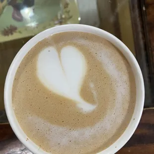 a cup of coffee with a heart drawn in it