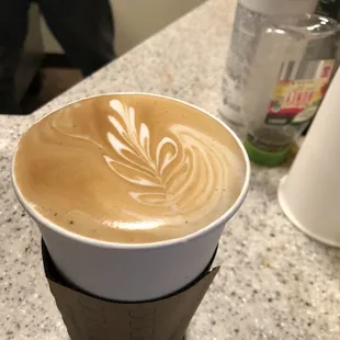 a cup of coffee on a counter