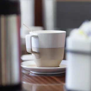 a cup of coffee on a table