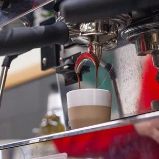 coffee being poured into a cup