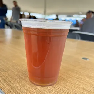 a cup of beer on a table