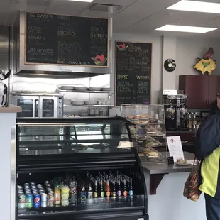 a woman standing in front of the counter