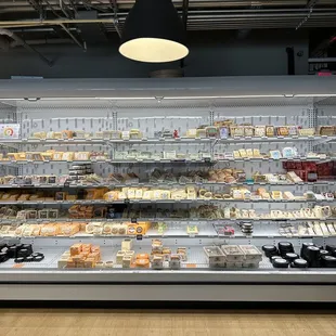 a display of cheeses and pastries