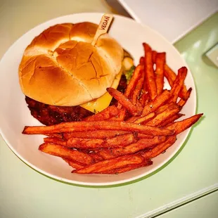 Spicy Chicken Sandwich with avocado, cheese, vegan bacon and sweet potato fries!