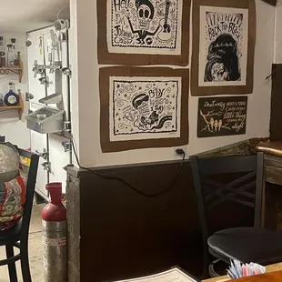 a dining area with a table and chairs