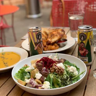 Front to back: beet salad, butternut squash soup, kimchi grilled cheese, with two cans of kombucha