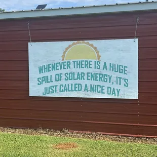 a sign that reads whenever there is a huge spill of solar energy, it's just called a nice day