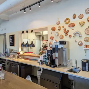 a coffee shop with a variety of items on the wall