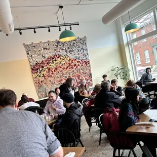 a large group of people sitting at tables