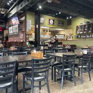 Main dinning area and kitchen in the back, bar to the left.