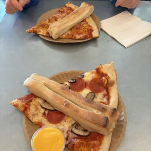 One slice and two breadsticks