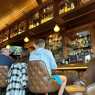 people sitting at a bar