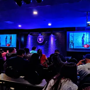 a crowd of people watching a show