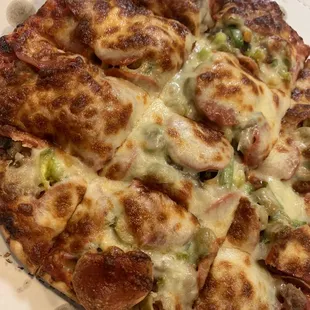 House Special Sausage, pepperoni, onion, mushrooms, green peppers, and green olives.