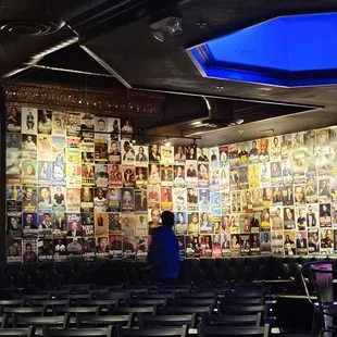 rows of chairs in front of a wall of magazines