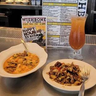 Breakfast, cajun shrimp and grits with a side of beef brisket hash.