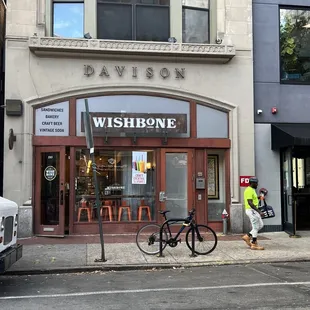 a bicycle parked in front of a store