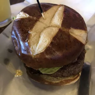 Blue cheese burger . Caramelized onions and blue cheese were very good. Love the pretzel bun option.