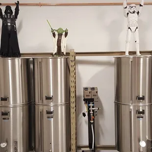 a row of stainless steel tanks