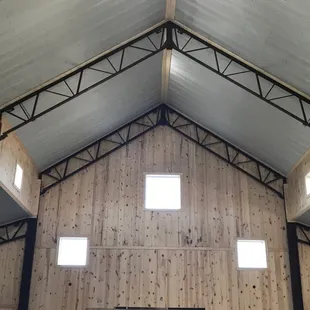 Exposed beams, shiplap walls and steel ceiling