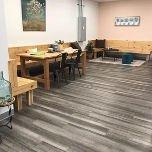 a waiting room with a table and chairs