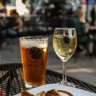 a plate of food and a glass of wine