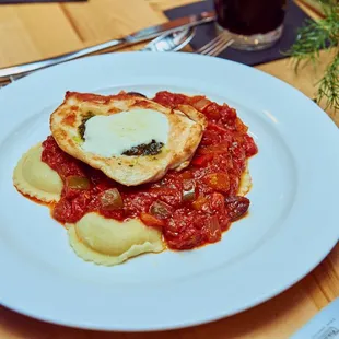 a white plate with a heart - shaped piece of pizza on it