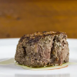 a steak on a white plate