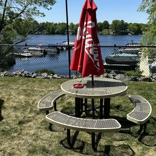 a picnic table with an umbrella