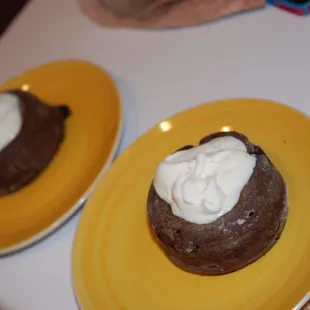 two desserts on yellow plates