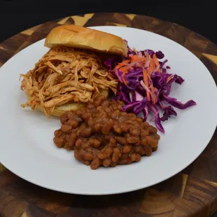 Pulled chicken, baked beans and sweet and sour cabbage carrot slaw