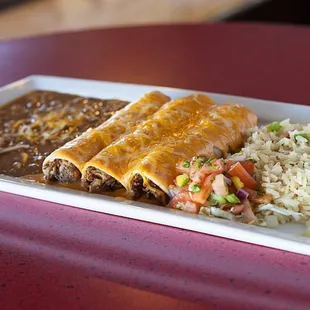 Brisket Enchiladas topped with Chipotle Cream Sauce.