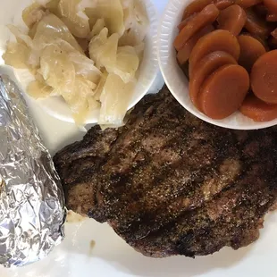 12oz Ribeye Steak, baked potato, carrots &amp; cabbage.