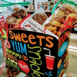 A gift bag with assorted candies and nuts.