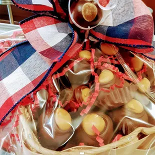 Our delicious buckeyes gift wrapped in an Ohio shaped basket.