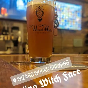 a glass of beer on a table