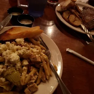 Penne pasts with grilled chicken and very tender ribeye steak and fried potatoes