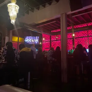 people sitting at a bar