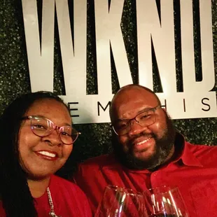 a man and a woman holding wine glasses