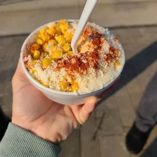 a person holding a bowl of food