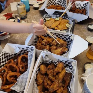 a table full of fried food